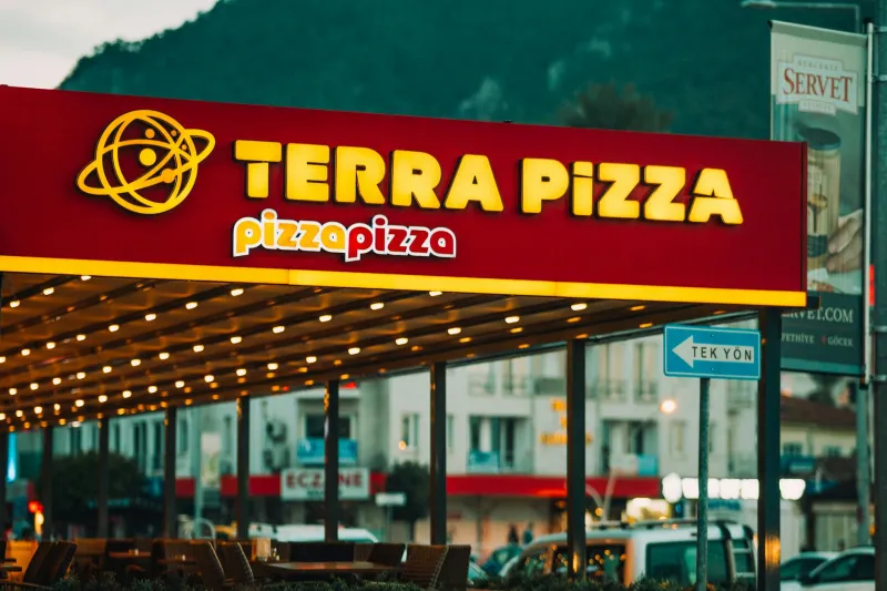 Strip Mall Pizza Prophets: Why the Best Slice in America Hides Behind Neon Signs